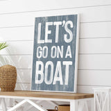 a wooden sign that says let&#39;s go on a boat