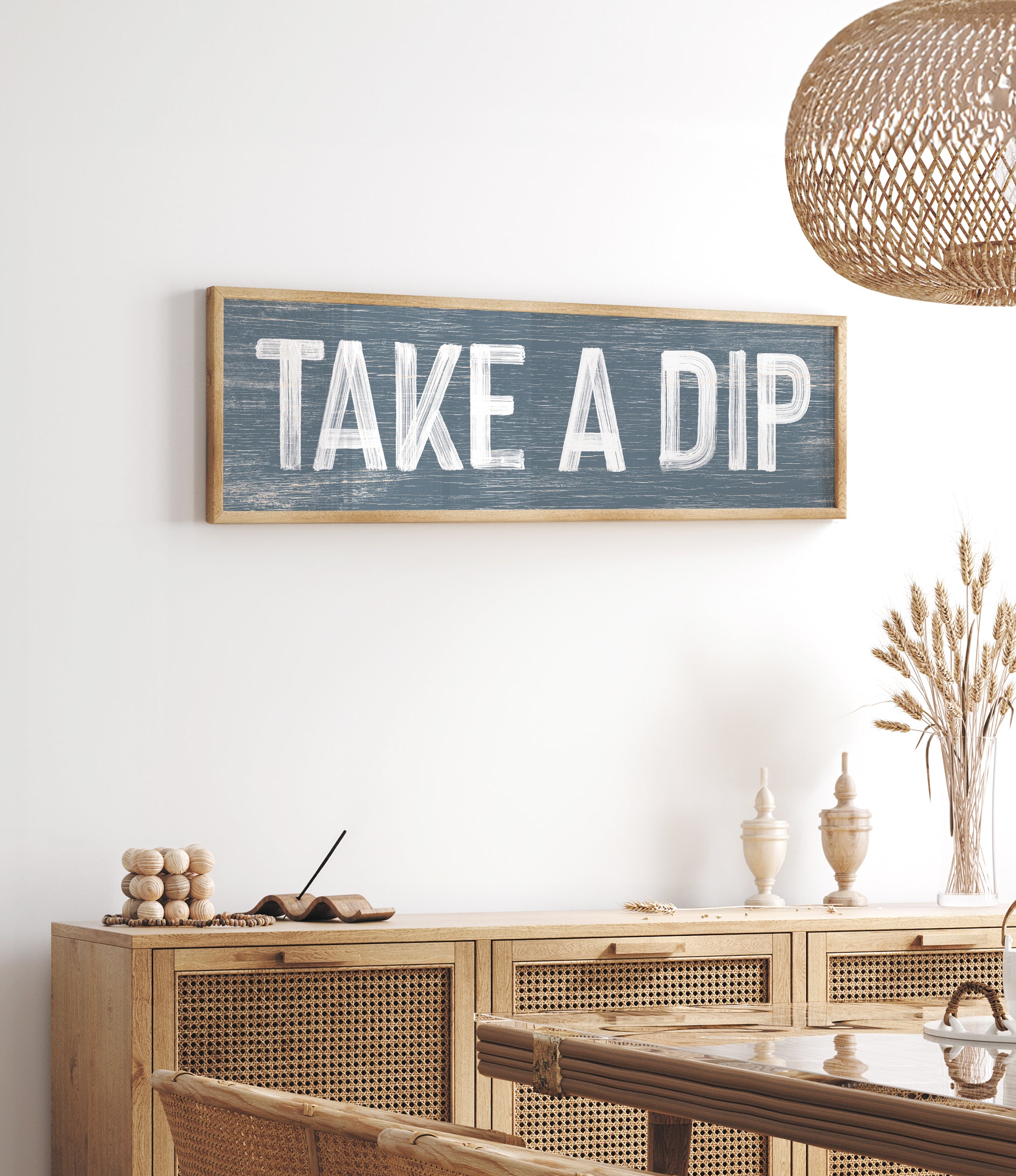 a wooden sign that says take a dip