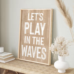 a wooden sign that says let&#39;s play in the waves
