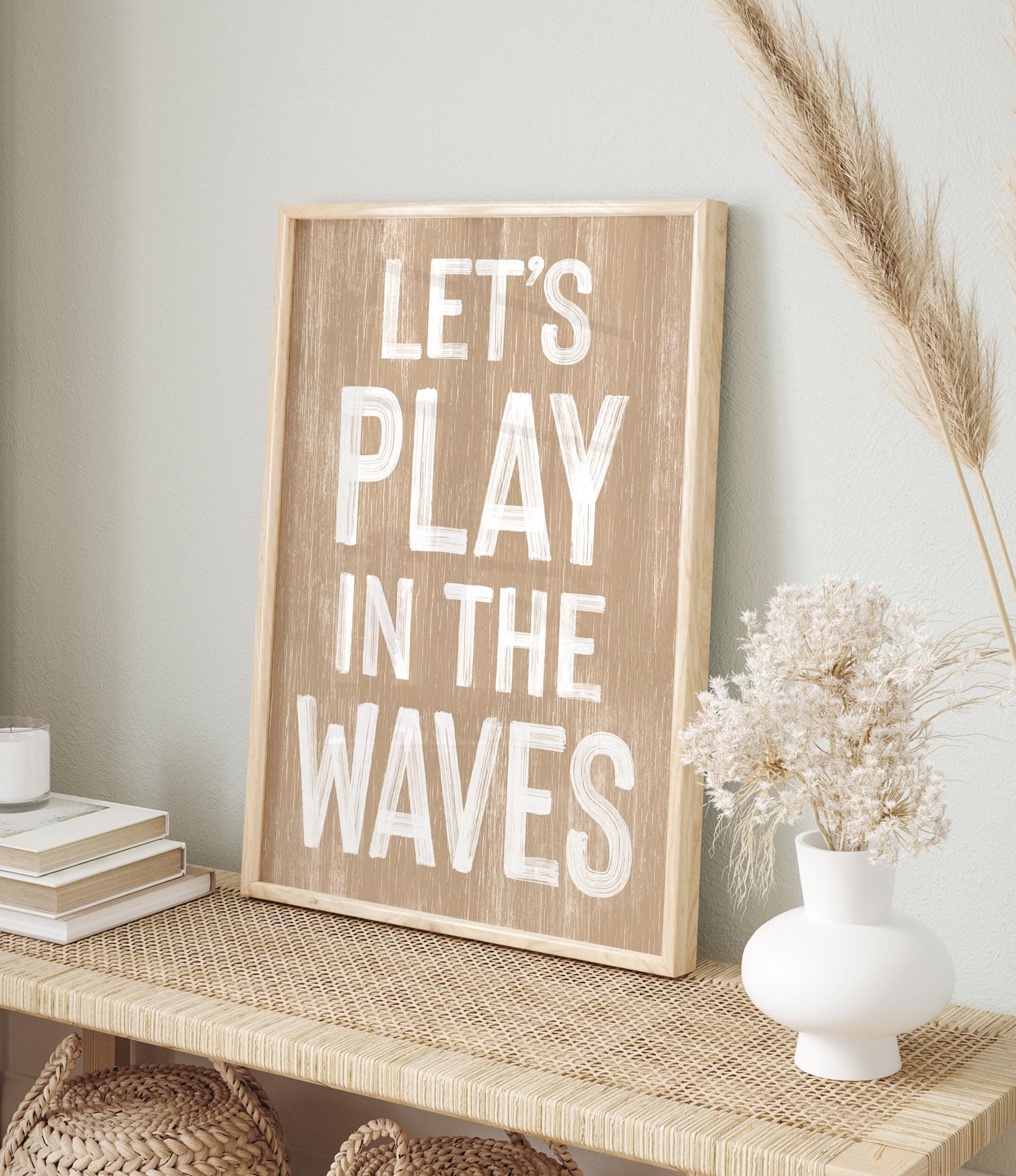 a wooden sign that says let&#39;s play in the waves