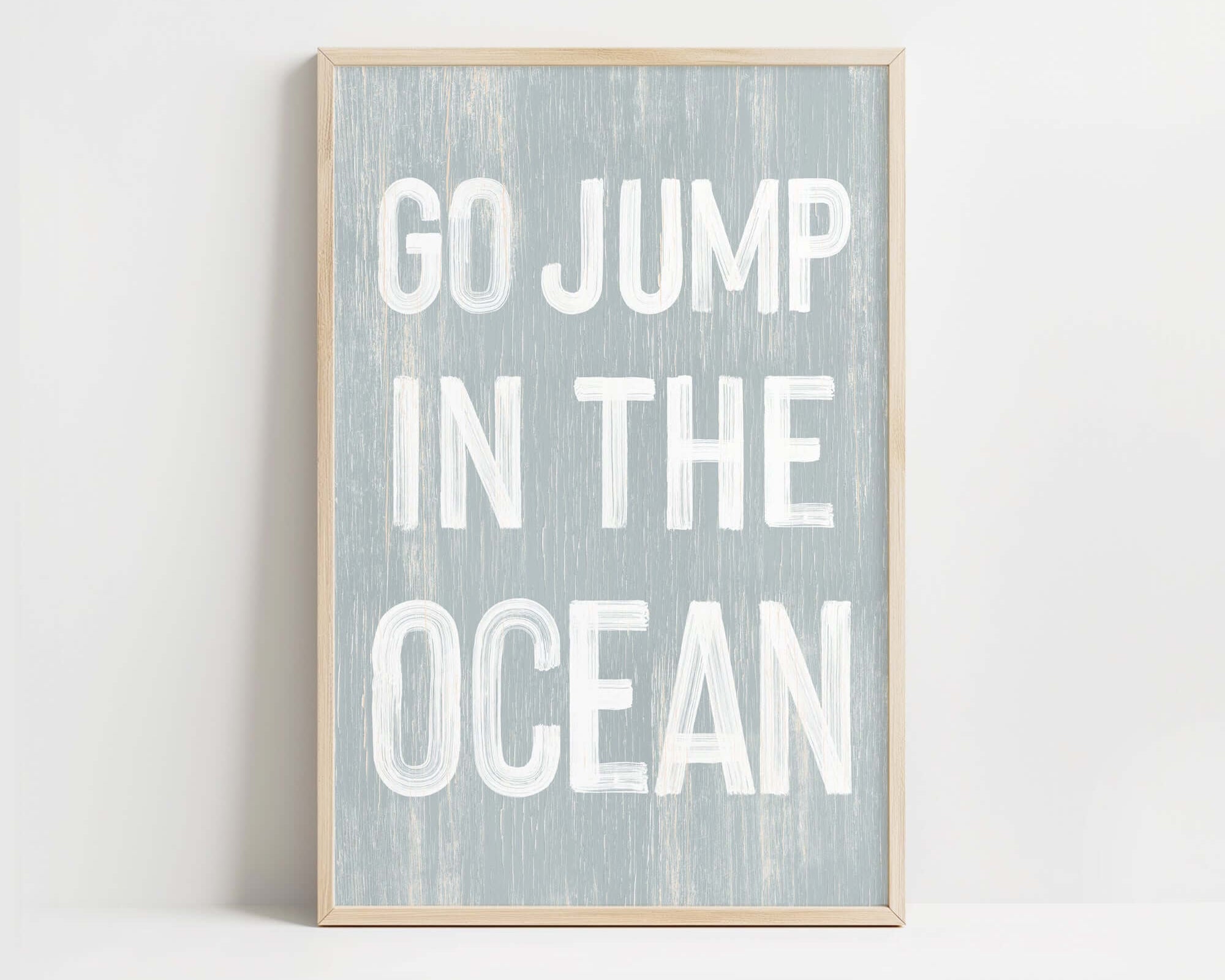 a white and blue print with the words go jump in the ocean