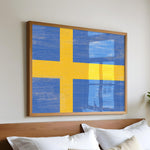 a bed with white pillows and a painting on the wall
