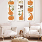a living room with two chairs and two pumpkins