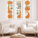 a living room with two chairs and two pumpkins