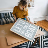 a woman holding a sign that says let&#39;s do what you want