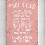 a pink sign that says pool rules on it