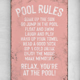 a pink sign that says pool rules on it