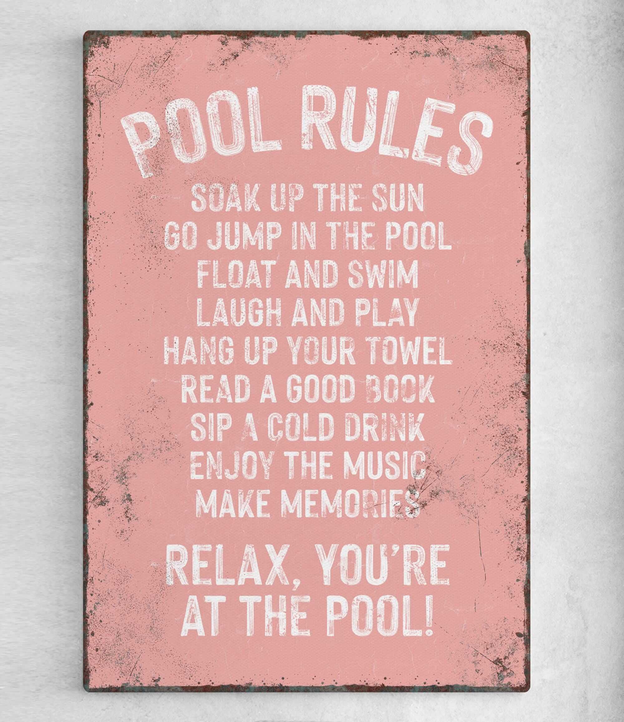 a pink sign that says pool rules on it