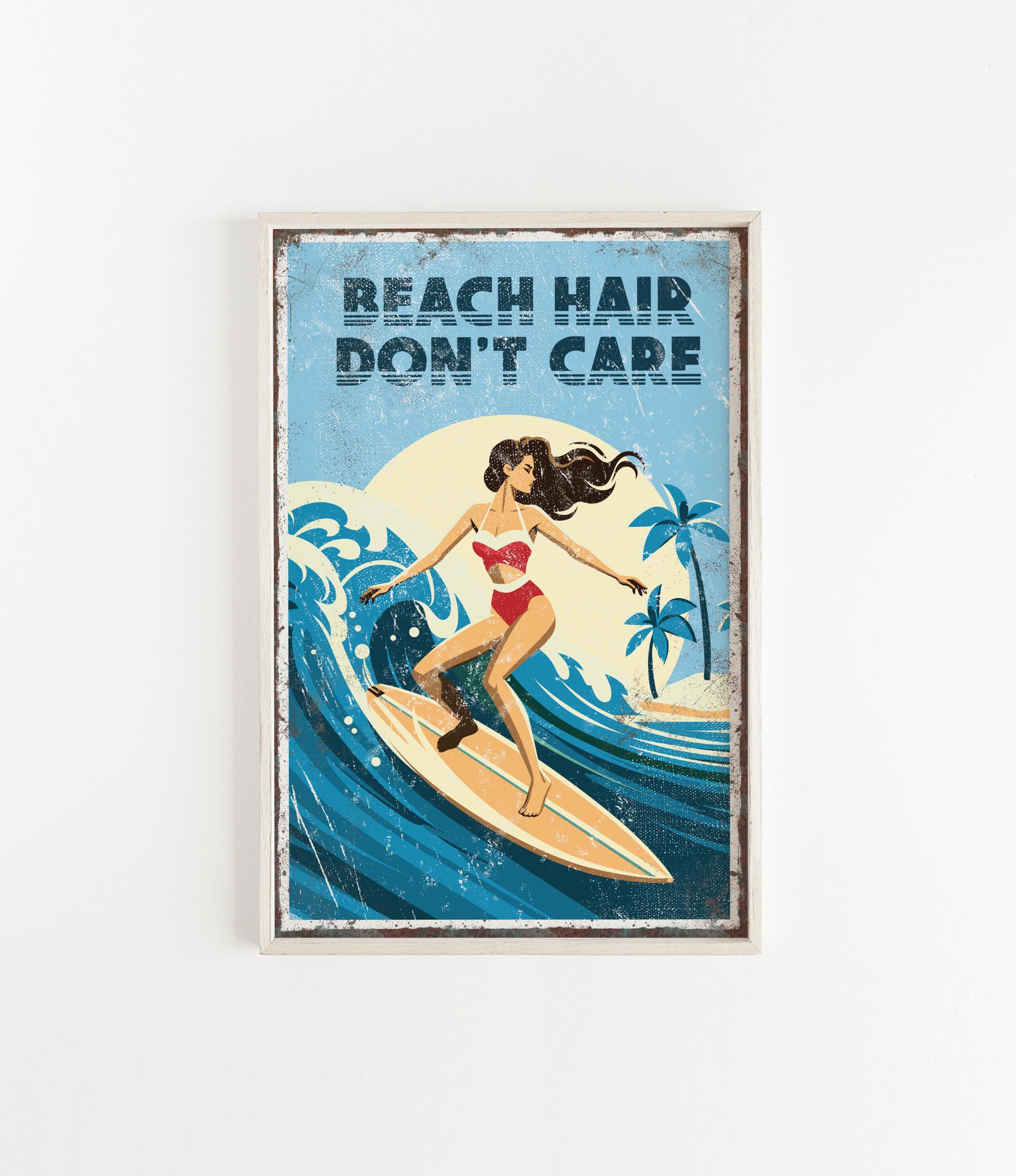 A framed poster with a woman surfing on a wave, with the text "REACH HAIR DON'T CARE" written above the image.