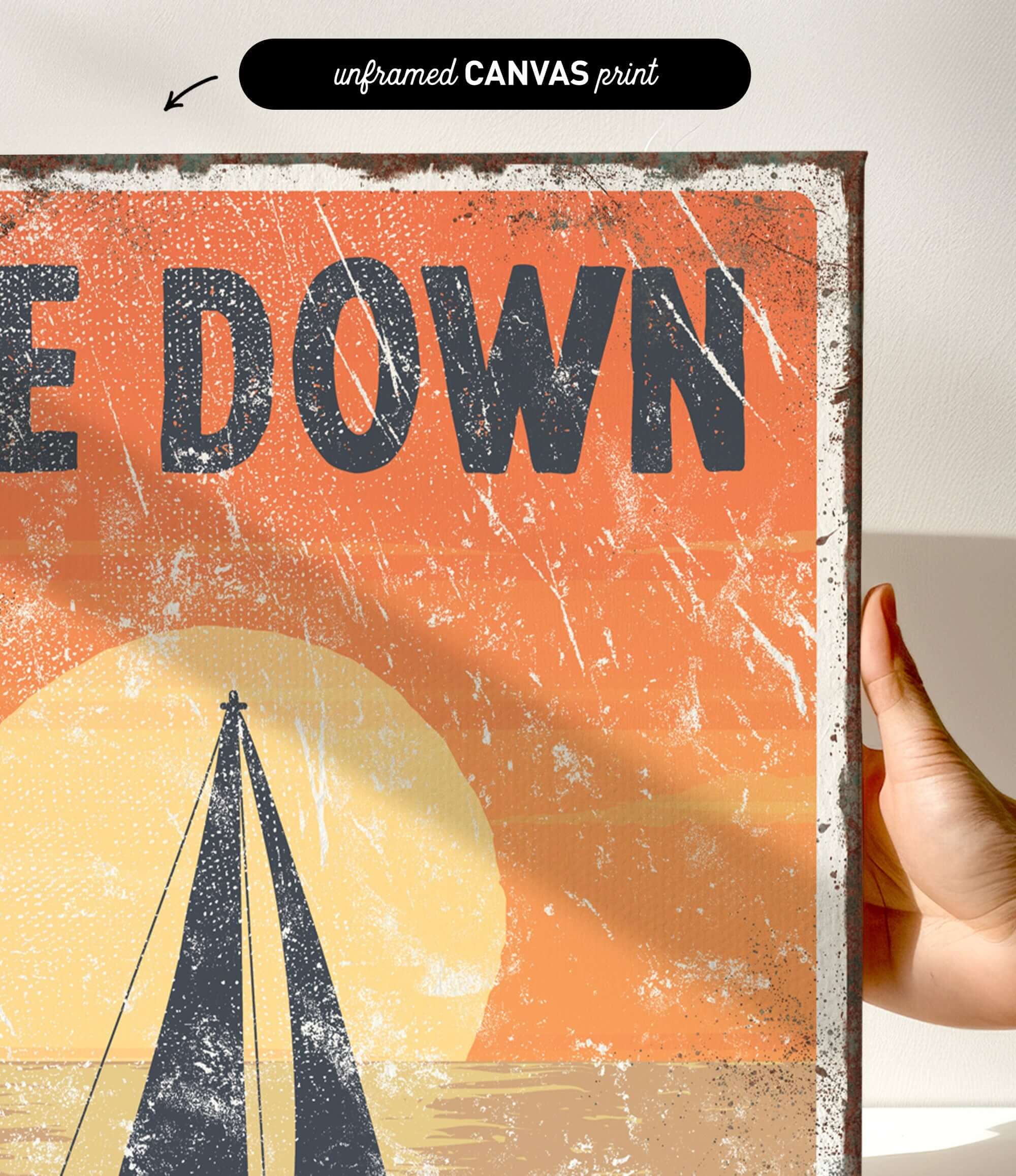 a hand holding up a poster with a sailboat on it