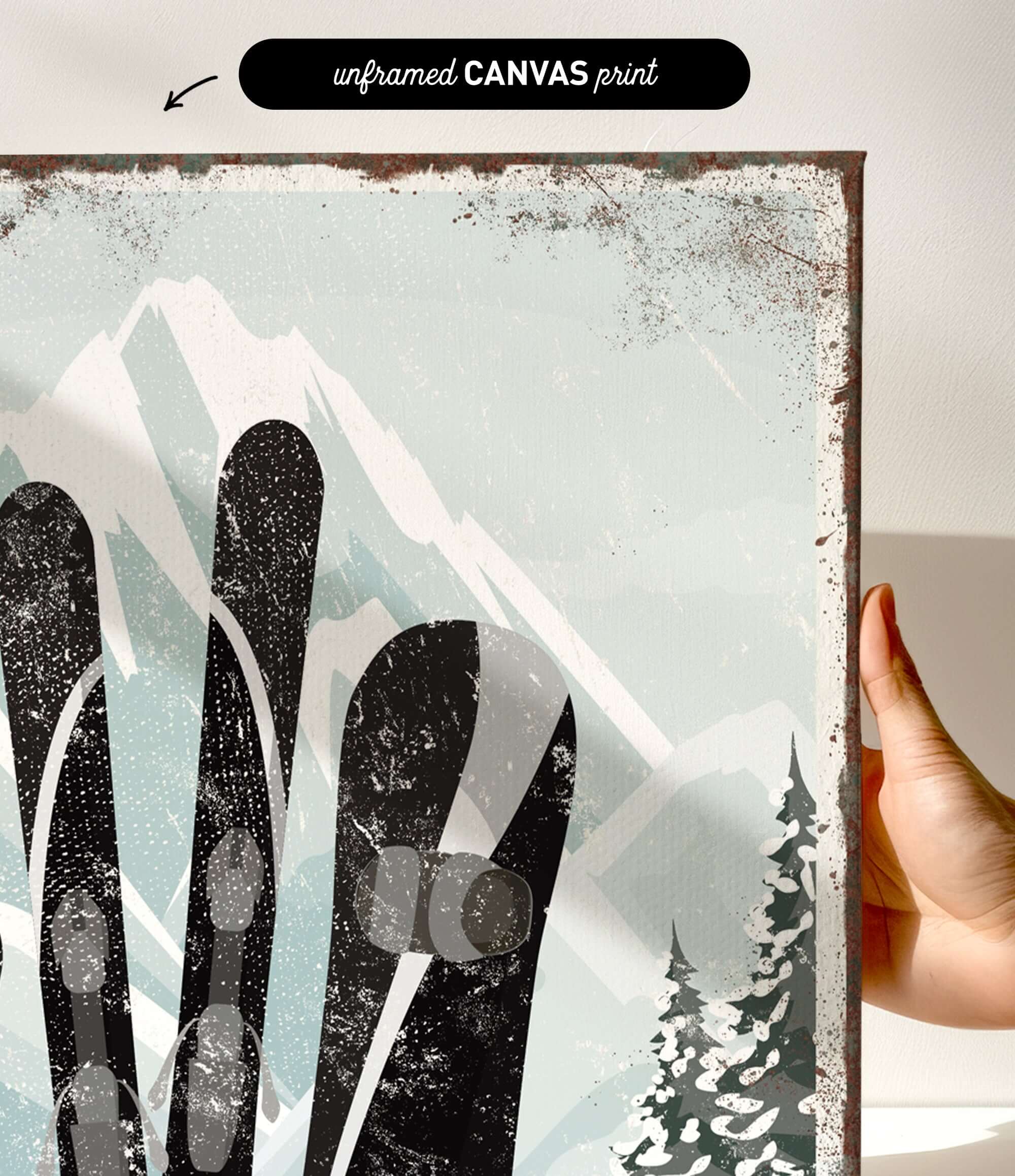 a hand holding up a picture of a pair of skis