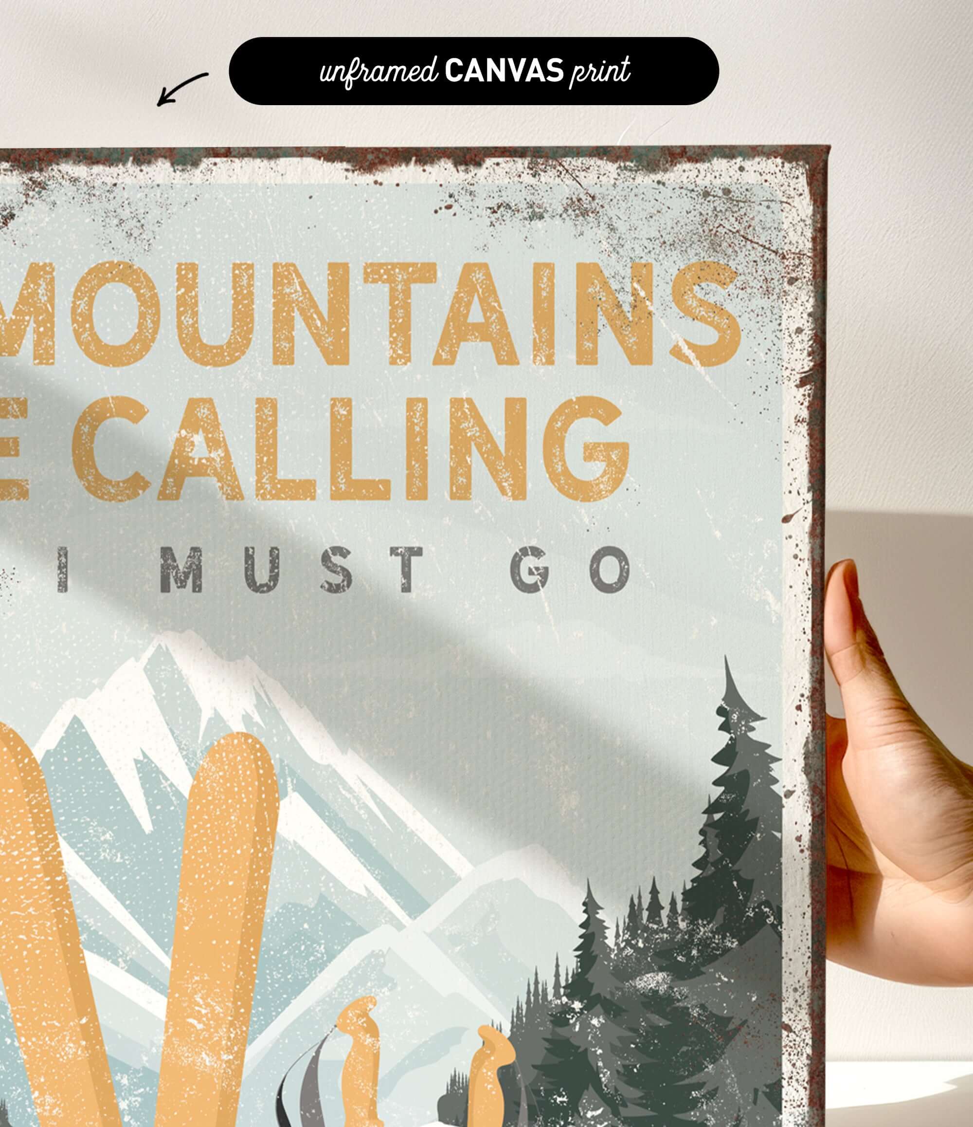 a hand holding a sign that says mountains are calling