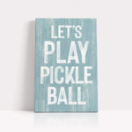 a wooden sign that says let's play pickle ball