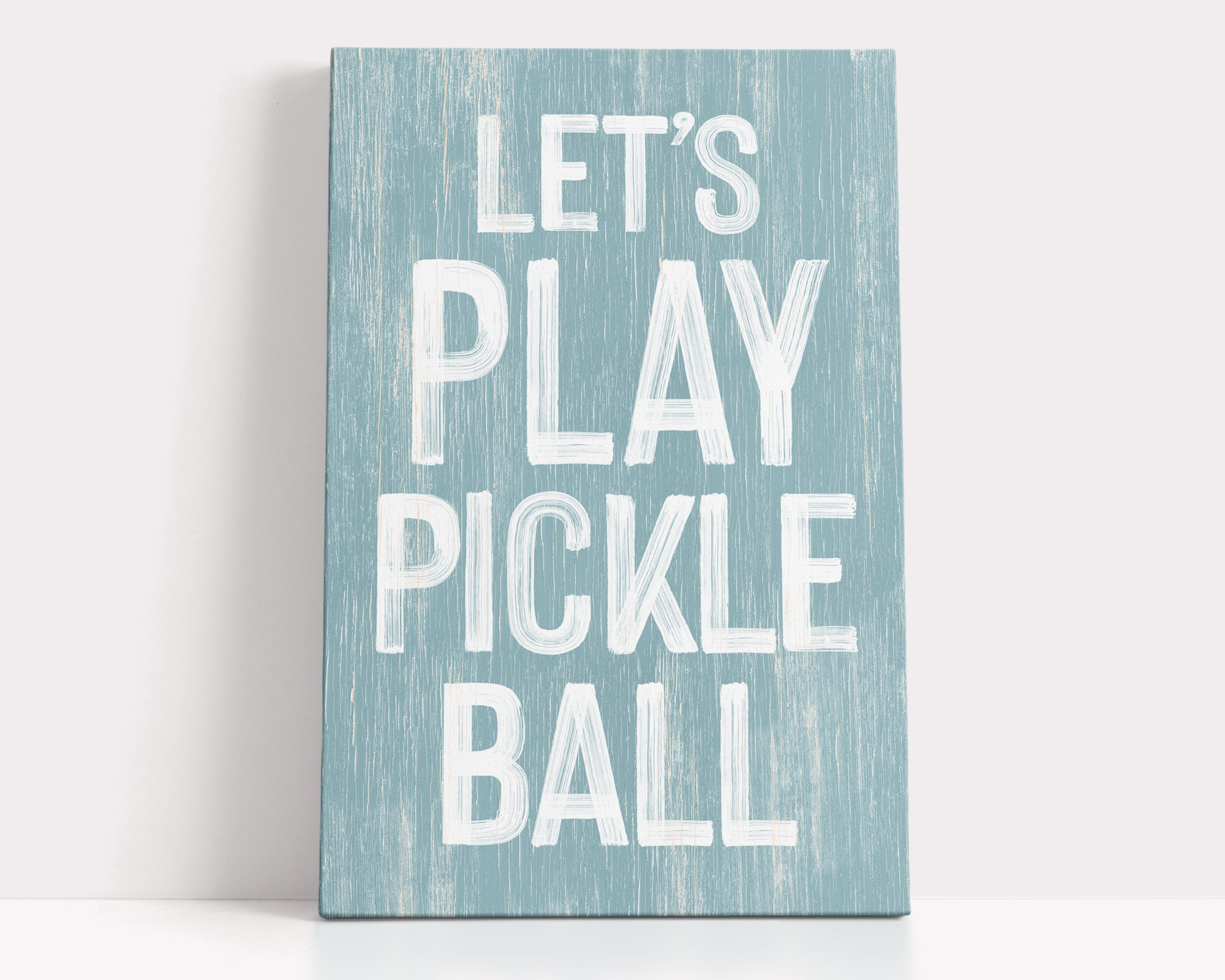 a wooden sign that says let's play pickle ball