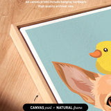a vibrant illustration of a yellow duck and a brown rabbit, with the duck peeking out from behind the rabbit's head. The artwork is framed in a natural frame, and the text indicates that the artwork wraps around the sides of the canvas, and all canvas prints include hanging hardware for high-quality archival inks.