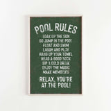 a green sign that says pool rules hanging on a wall