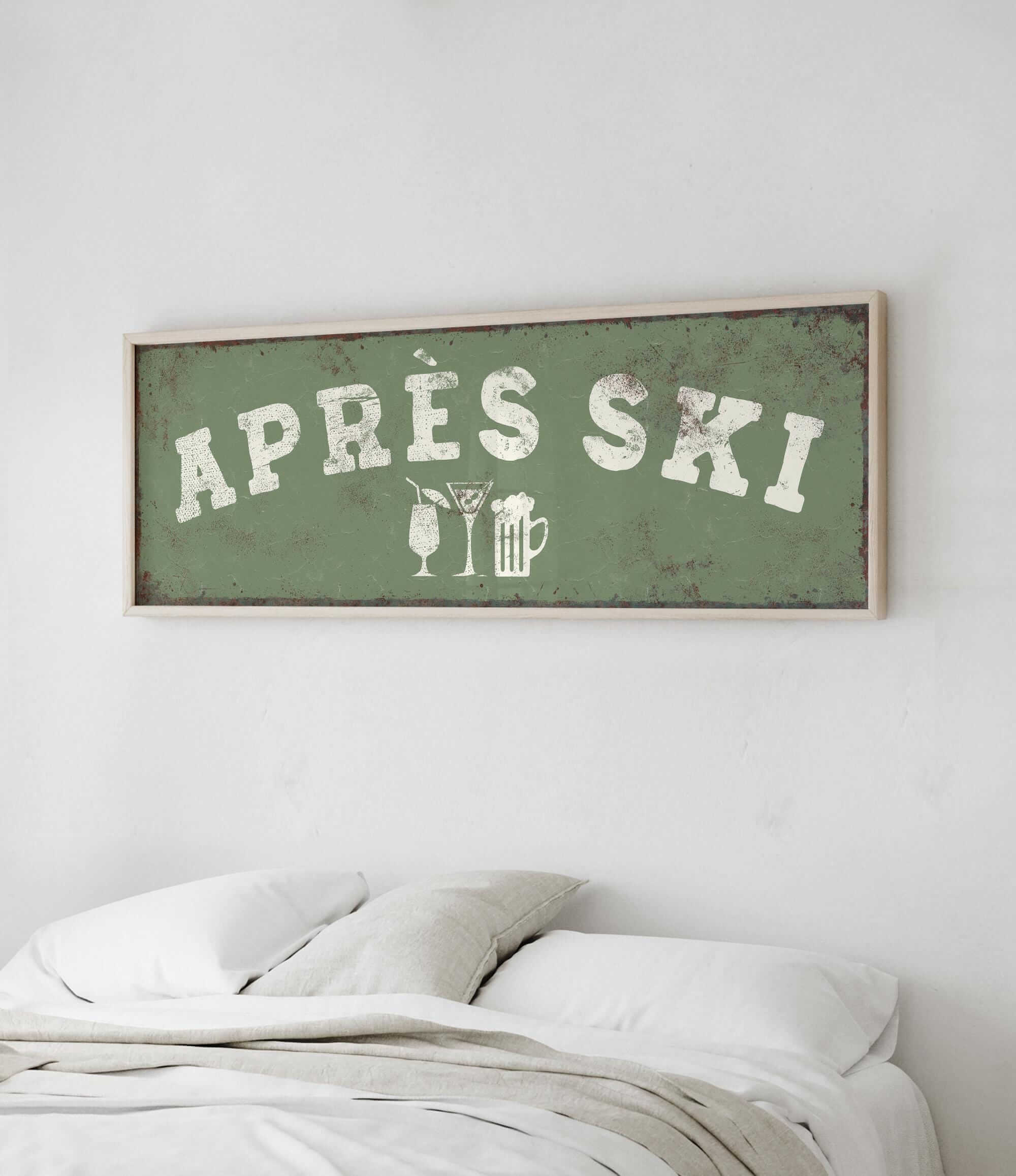 a bed with white pillows and a green sign with white text hanging above it.