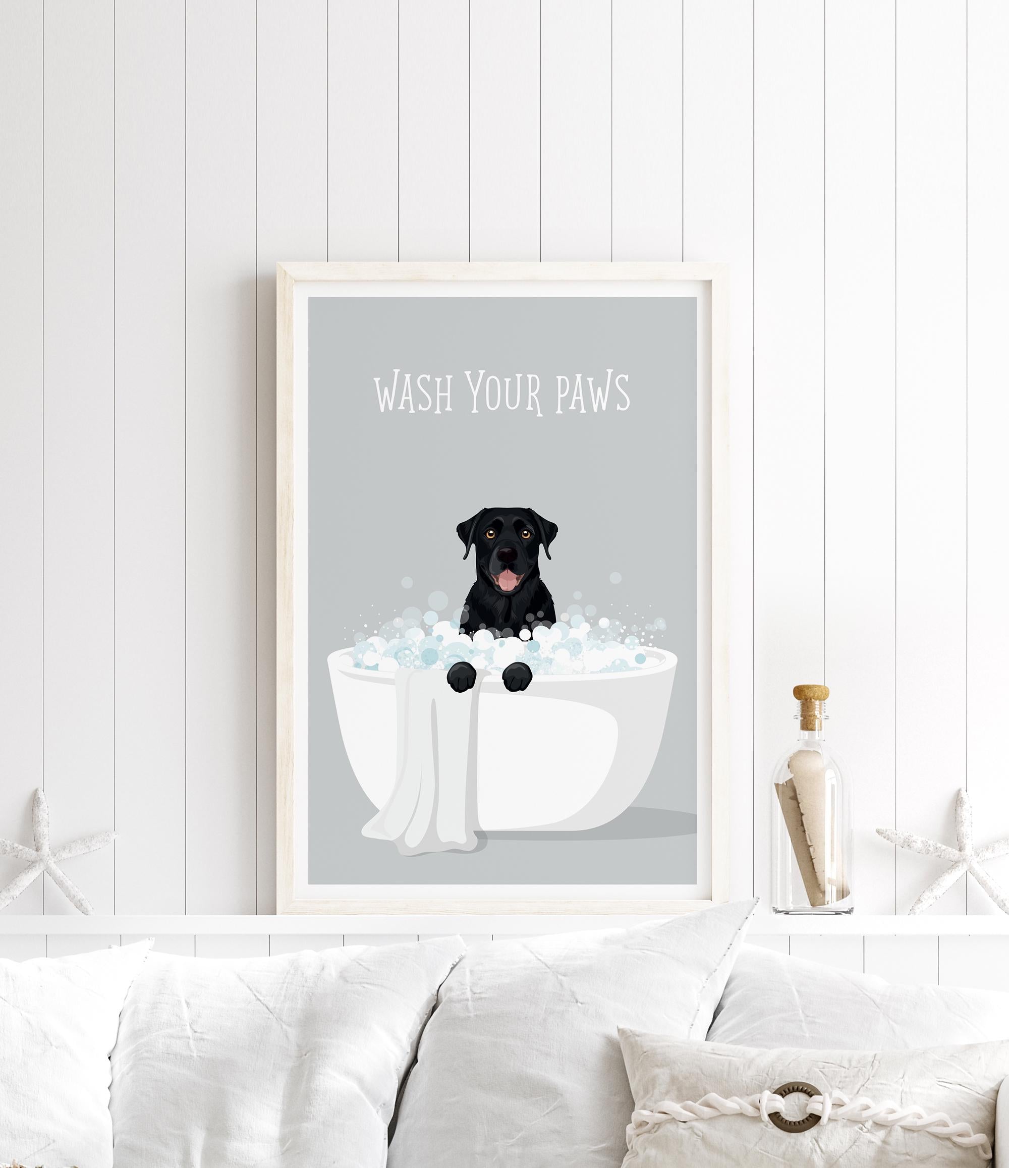 A framed poster with a black dog sitting in a white bathtub filled with bubbles, with the text "WASH YOUR PAWS" displayed above it.