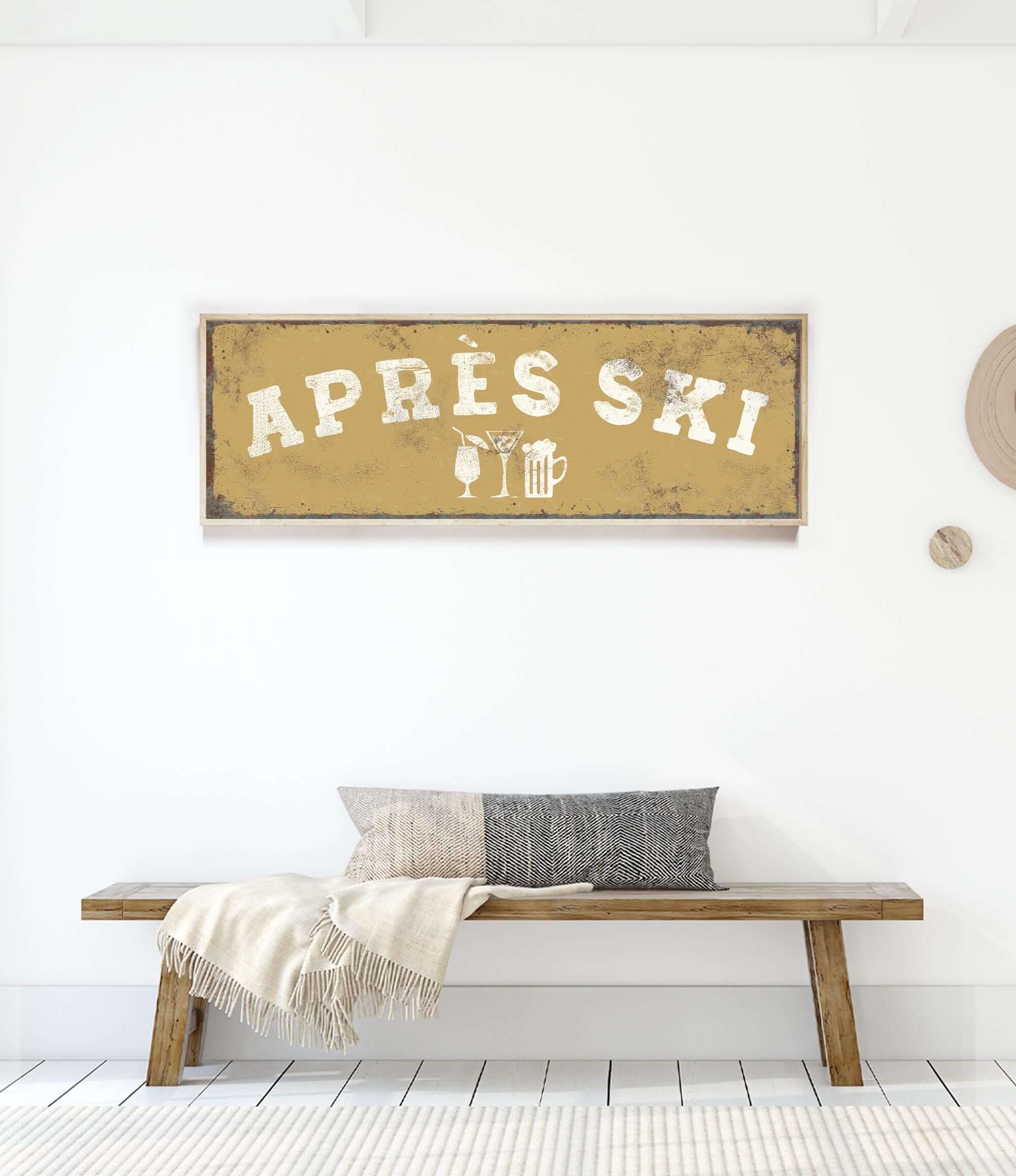 a wooden bench with a gray and white throw pillow, and a framed sign with the word "APRESS" on it.
