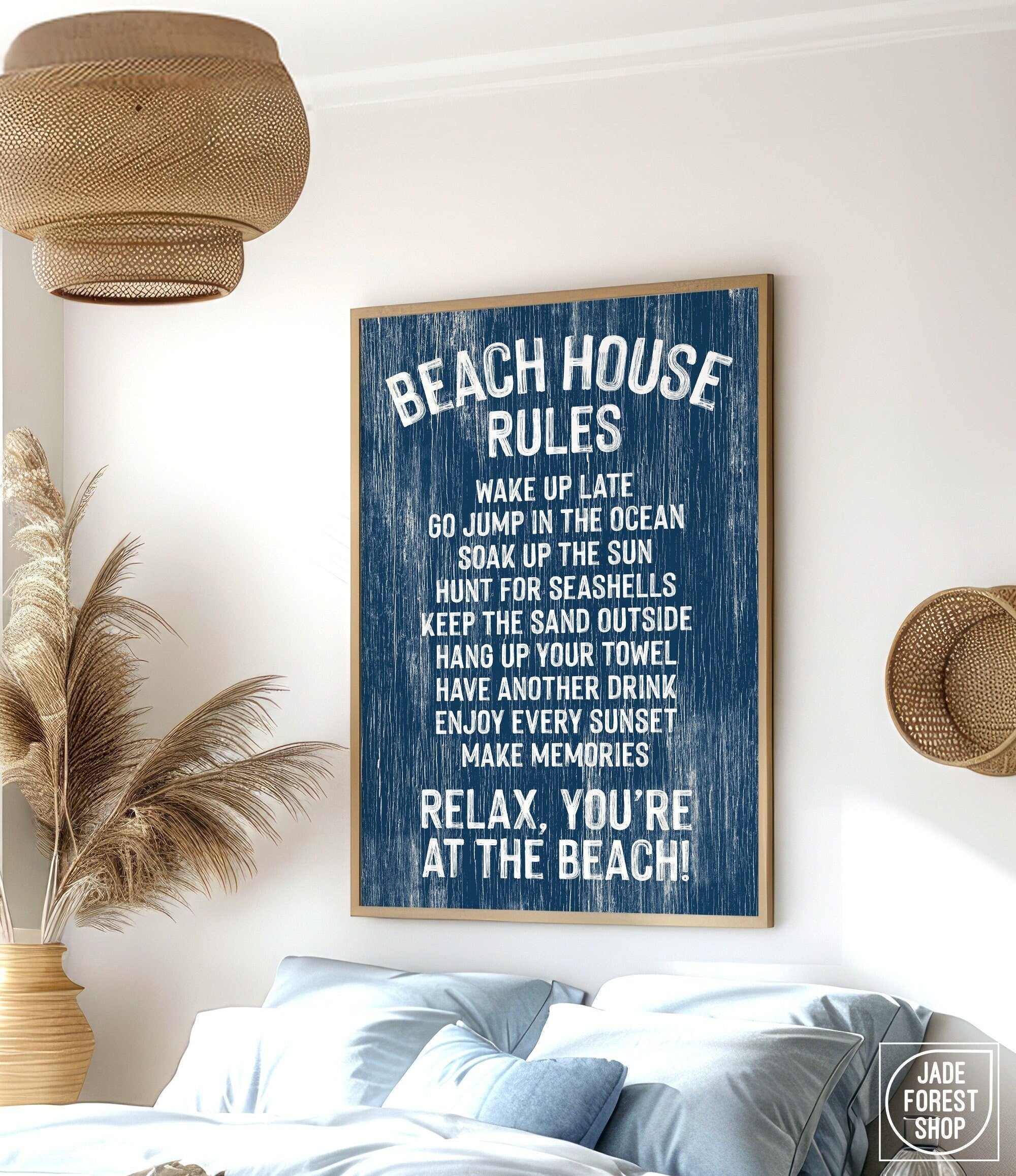 The Beach House Rules Sign, a blue painted wood nautical piece, hangs on the wall listing relaxing activities, adding cozy beach house decor to any room.