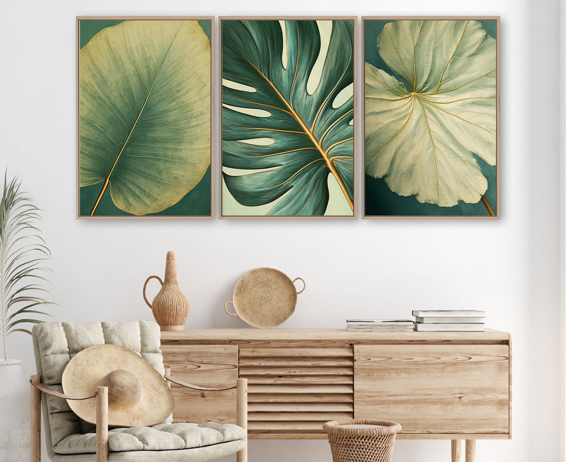 a living room with a wooden dresser, a woven basket, and a woven chair. Above the dresser, there are three framed prints of tropical leaves in different colors and sizes, creating a visually appealing and harmonious display.