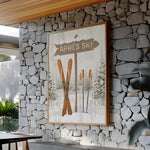 a stone wall with a picture of skis on it