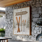 a stone wall with a picture of skis on it