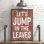 a wooden sign that says let's jump in the leaves