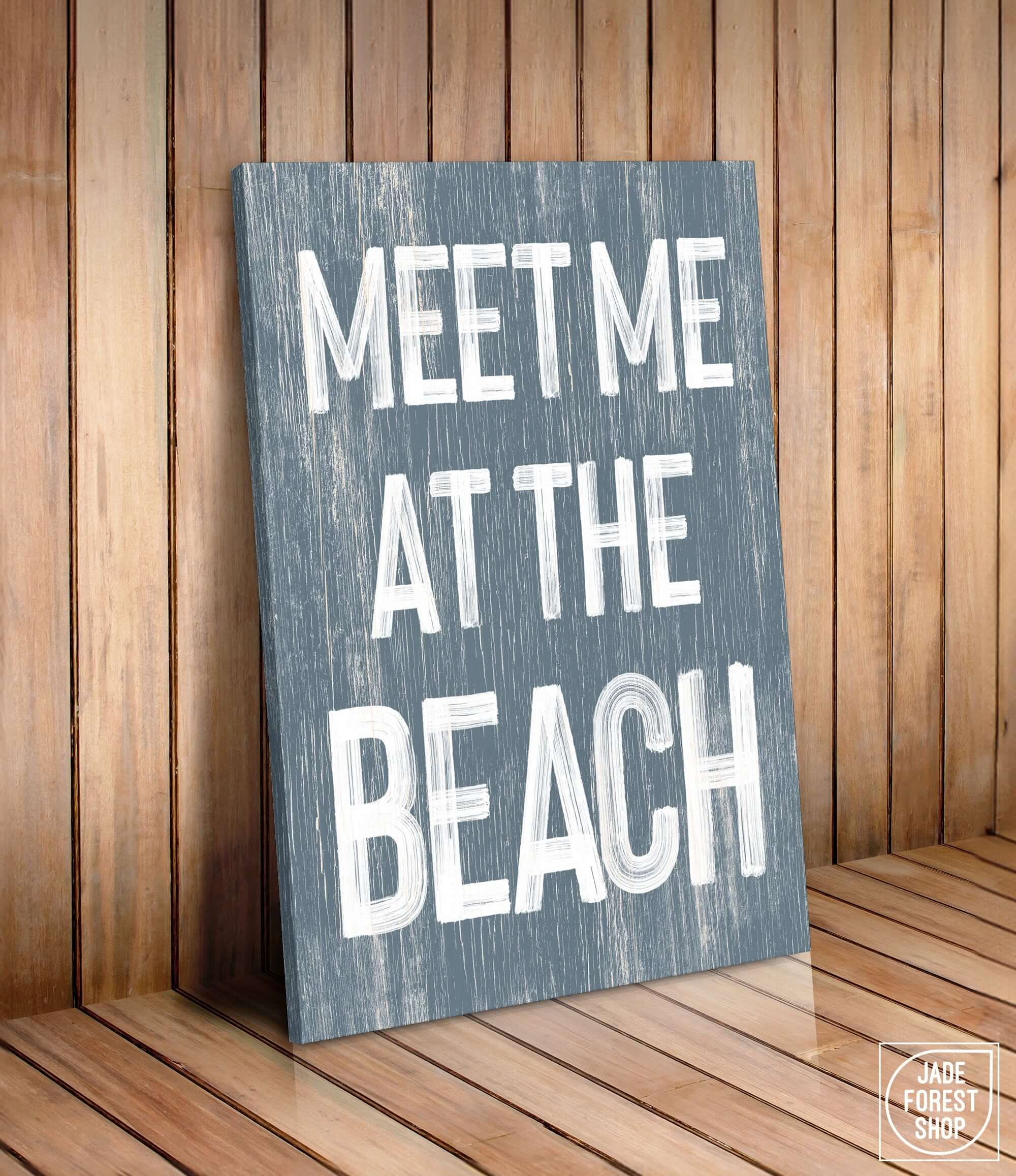 a wooden sign that says meet me at the beach