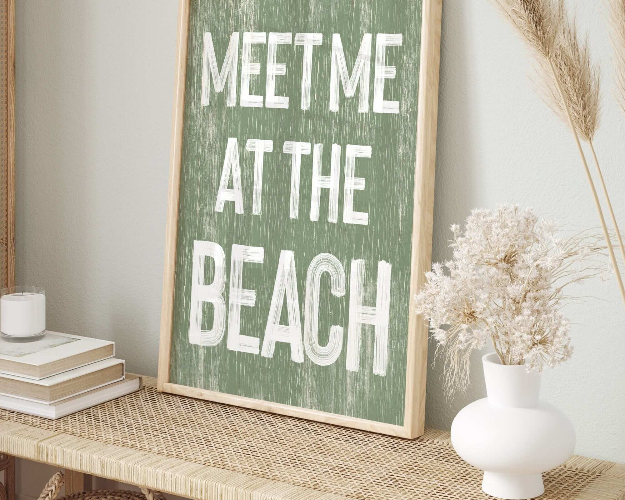 a sign that says meet me at the beach