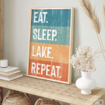 a picture of a sign that says eat sleep lake repeat