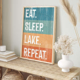 a picture of a sign that says eat sleep lake repeat