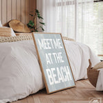 a bed with a sign that says meet me at the beach