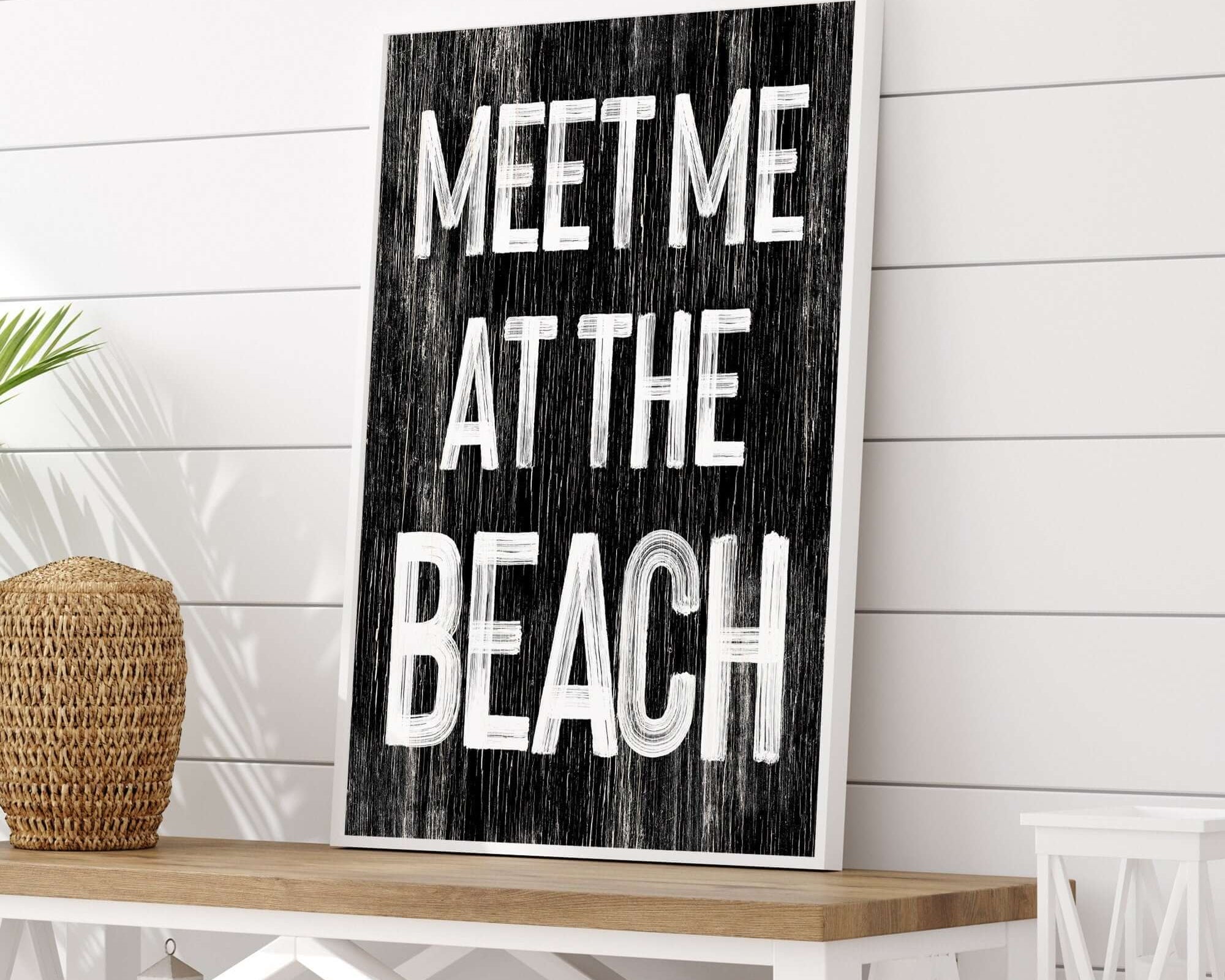 a sign that says meet me at the beach