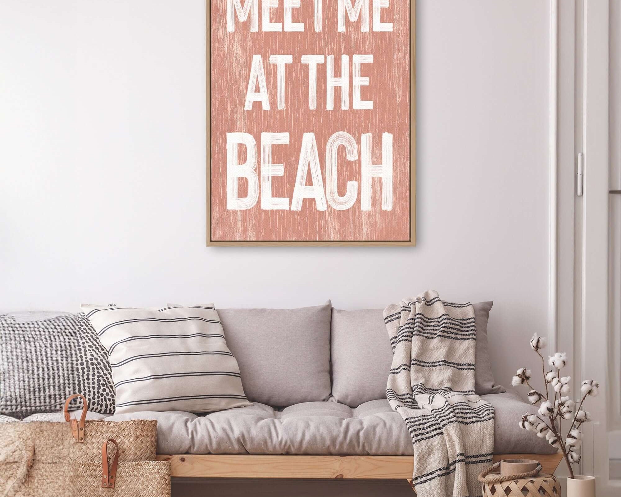 a living room filled with furniture and a wooden sign