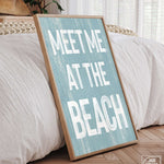 a wooden sign that says meet me at the beach