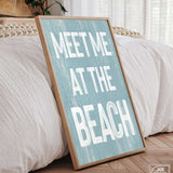 a wooden sign that says meet me at the beach