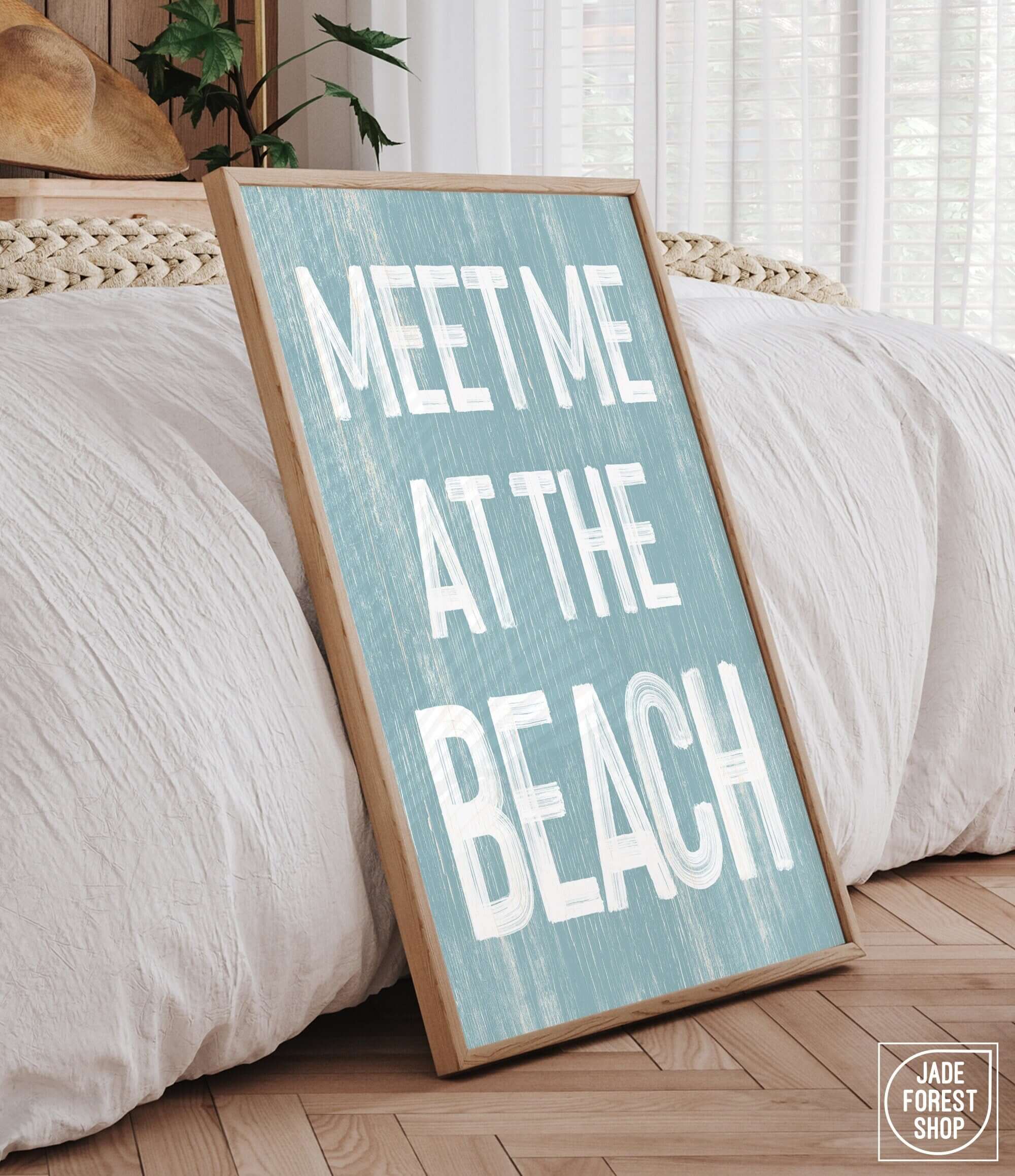 a wooden sign that says meet me at the beach