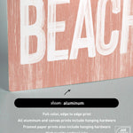 a wooden sign that says beach on it