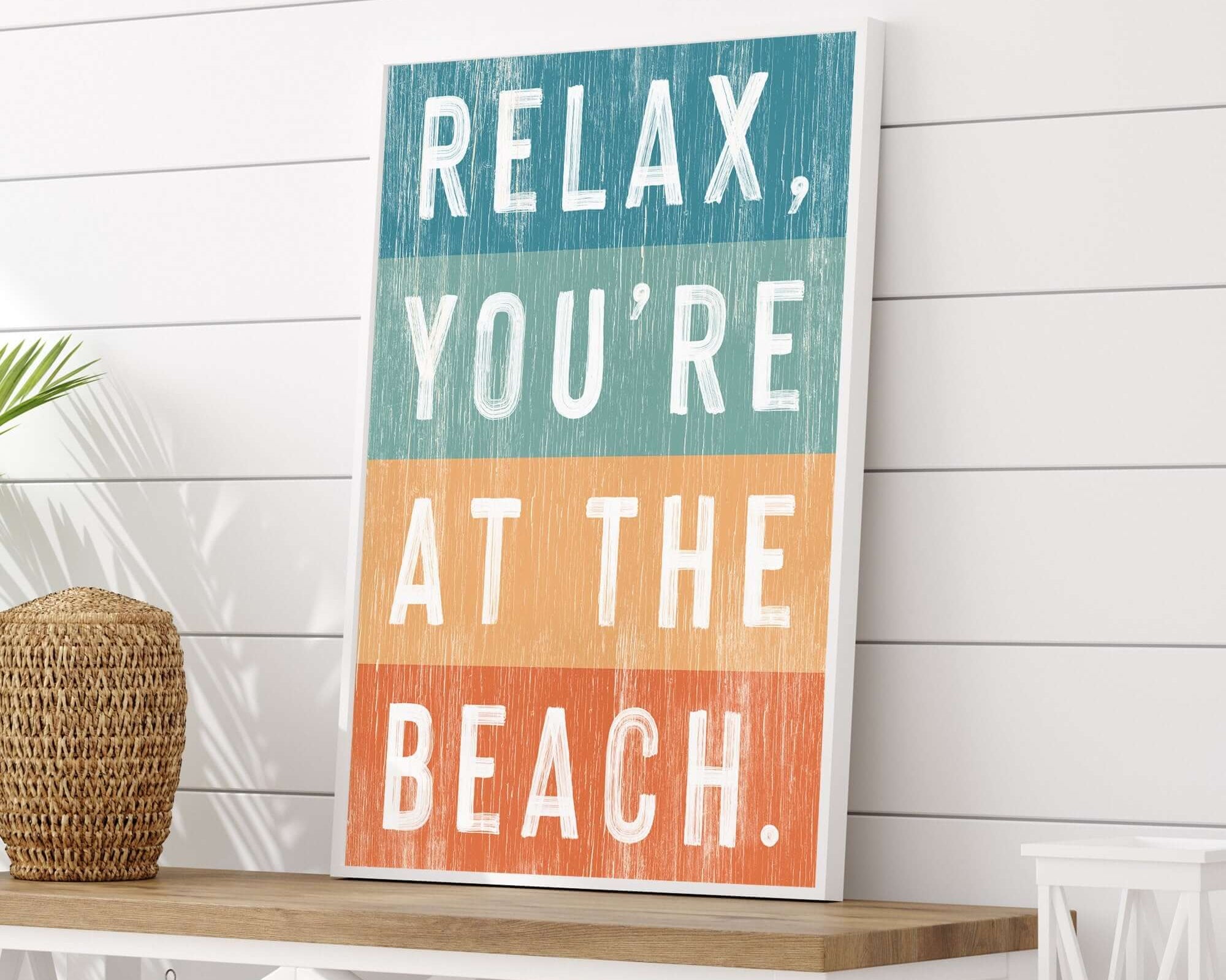 a sign that reads relax, you're at the beach