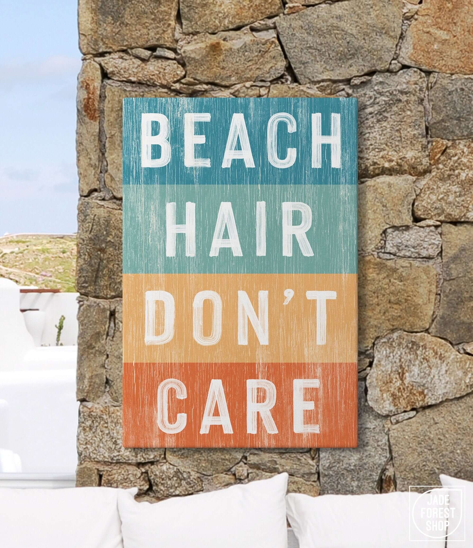 a sign that says beach hair don't care on a stone wall