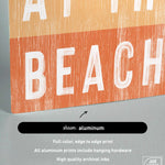 a picture of a sign that says at the beach