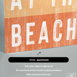 a picture of a sign that says at the beach