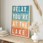 a sign that says relax, you're at the lake