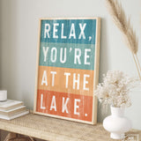 a sign that says relax, you're at the lake