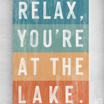 a sign that says relax, you're at the lake