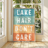 a sign that says lake hair don't care in front of a window