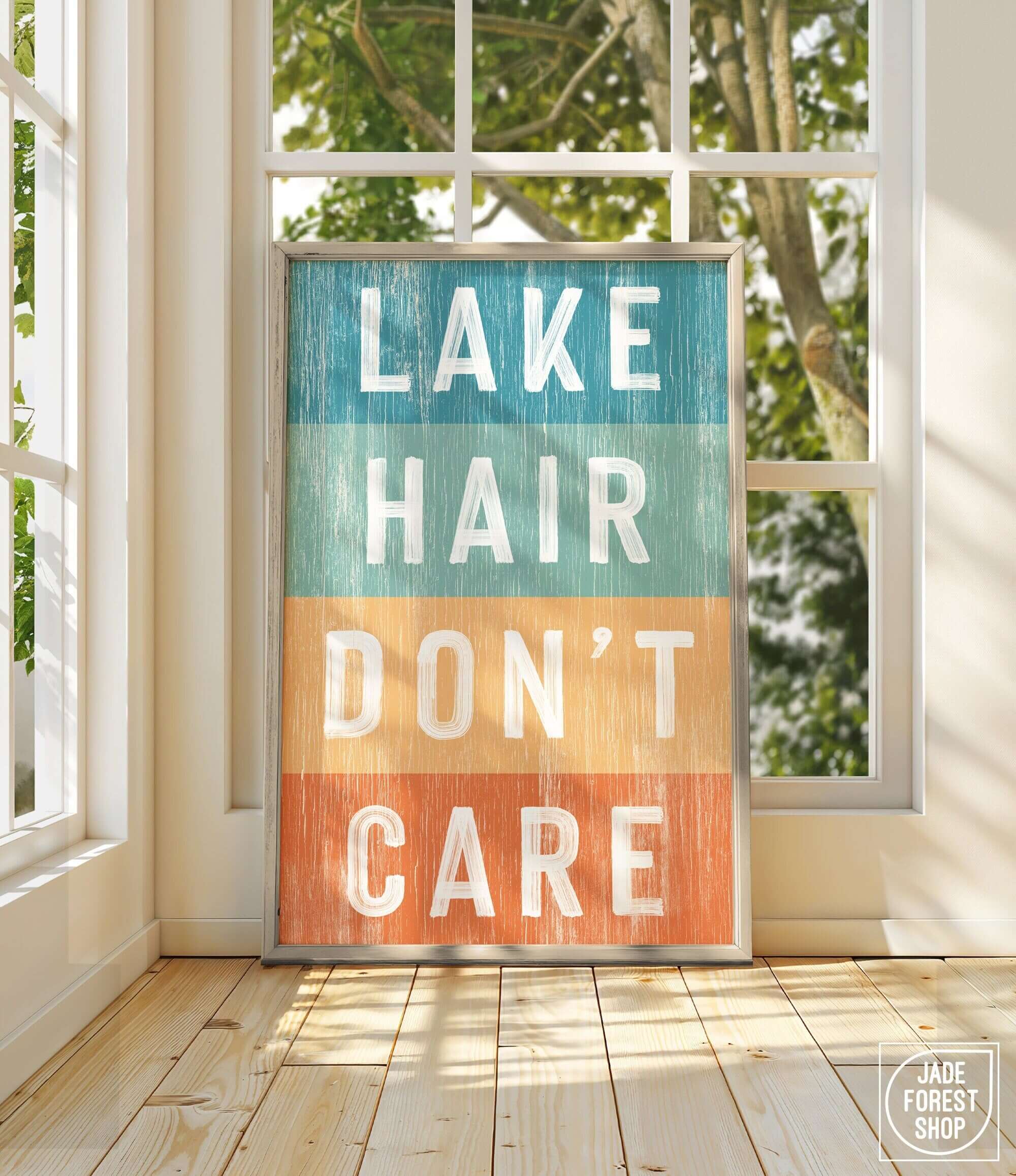 a sign that says lake hair don't care in front of a window