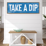 a blue and white sign that says take a dip