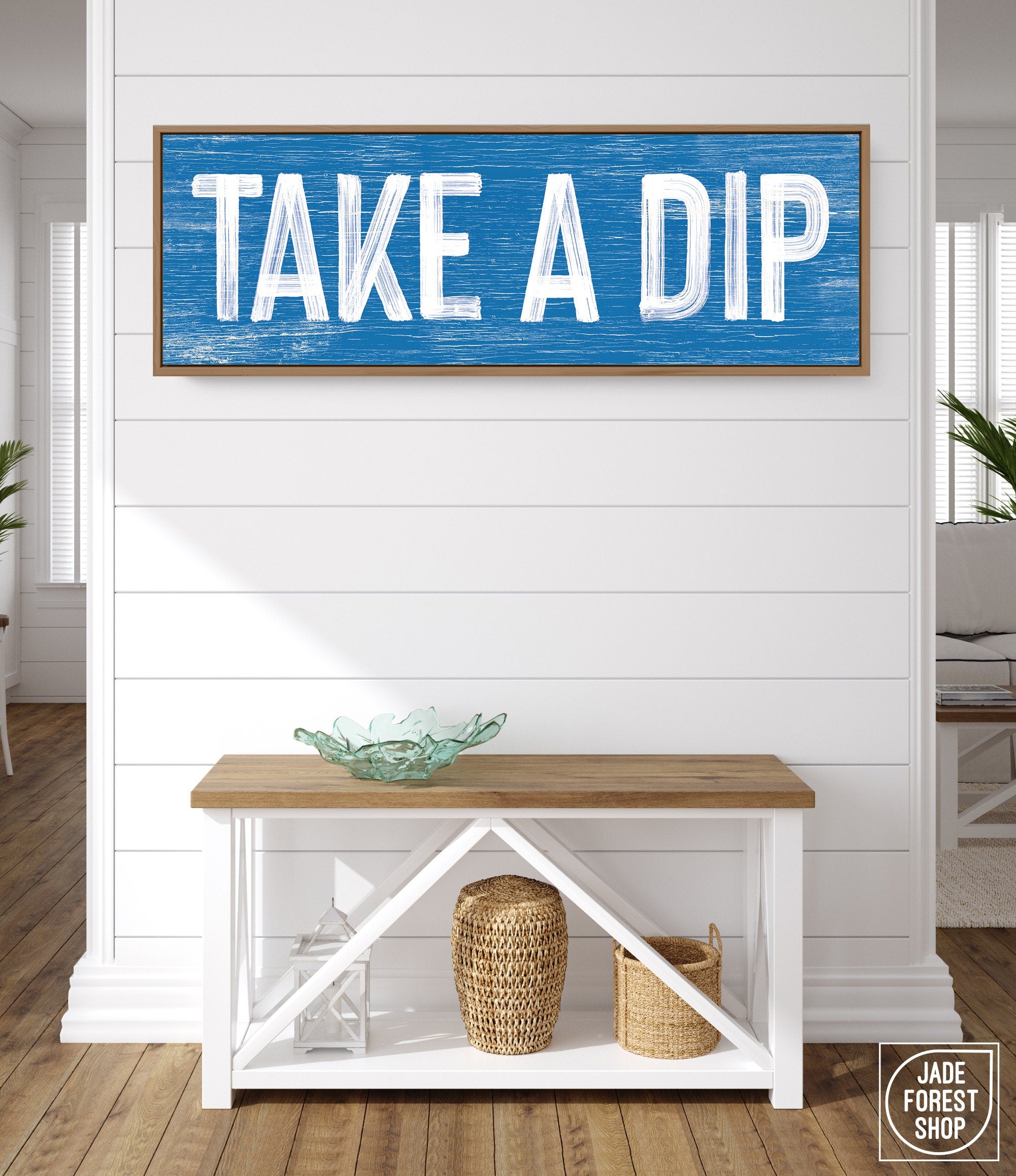 a blue and white sign that says take a dip